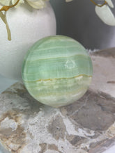 Load image into Gallery viewer, XL Pistachio Calcite Sphere
